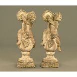 A pair of composition garden cherub with cymbal figures, each raised on a plinth base.