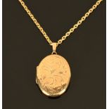 A 9 ct gold locket, with 9 ct gold chain, 10.4 grams gross.