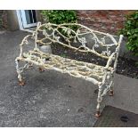 A Victorian branch form white painted wrought iron garden seat.