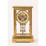 A 19th century brass four glass mantle clock,
