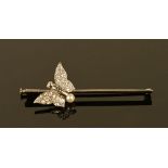 A white gold coloured metal stick pin, with diamond set butterfly with pearl to tail. 4.