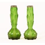 A pair of early 20th century Loetz style silver mounted green glass vases, hallmarks rubbed.