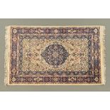 A Persian design rug, with signature, the centre rectangular panel decorated with vases,