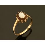 A 9 ct gold opal and garnet ring. Size P.