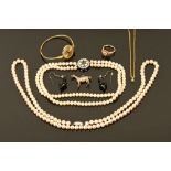 A collection of two simulated pearl necklaces, a heart shaped ring, a sterling silver horse charm,