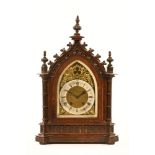 A Victorian oak Gothic bracket clock, with two train spring driven movement.