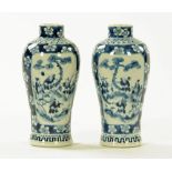 A pair of Chinese blue and white vases, decorated with figures and prunus,