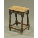An antique oak joint stool,