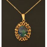 A 9 ct gold opal doublet pendant on 9 ct gold fine link chain.