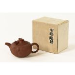 A Chinese Yixing teapot. Length 20 cm.