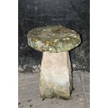 A sandstone staddle stone, with circular top and angled support. Height 66 cm, diameter 48 cm.
