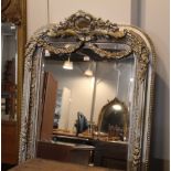 Silver framed mirror with carved motifs