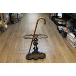 Early 20th century umbrella stand and walking stick