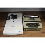 A Primax Colorado D600 copying machine together with a typewriter,