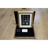 Framed set of proof coins and a coin box