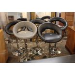 Four black leather bar stools and grey bar stool