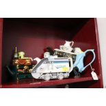 Three novelty teapots, removal men,