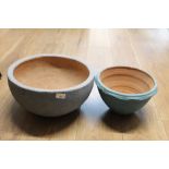 Large earthenware bowl with a blue painted finish and smaller blue painted bowl