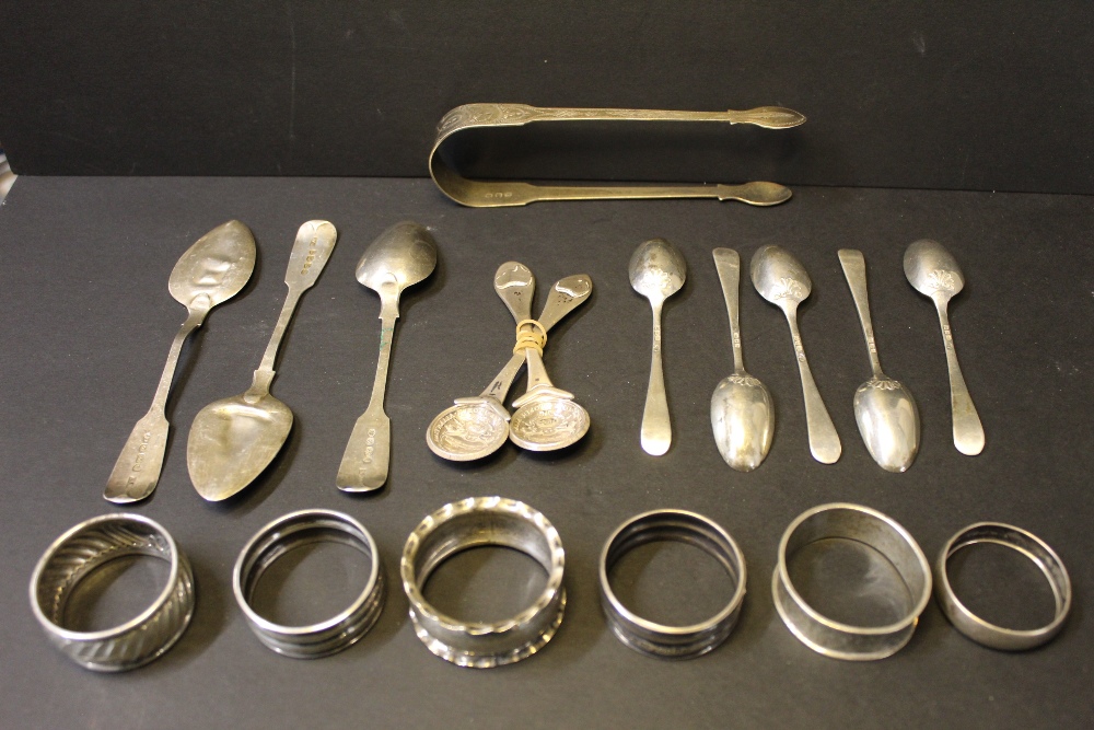 Mixed silver napkin rings and spoons