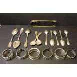 Mixed silver napkin rings and spoons