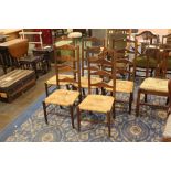 Five oak ladderback chairs with rush seats