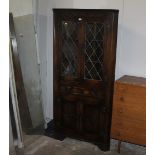 Jaycee lead glazed and oak carved corner cupboard, 182 cm tall, 82 cm wide,