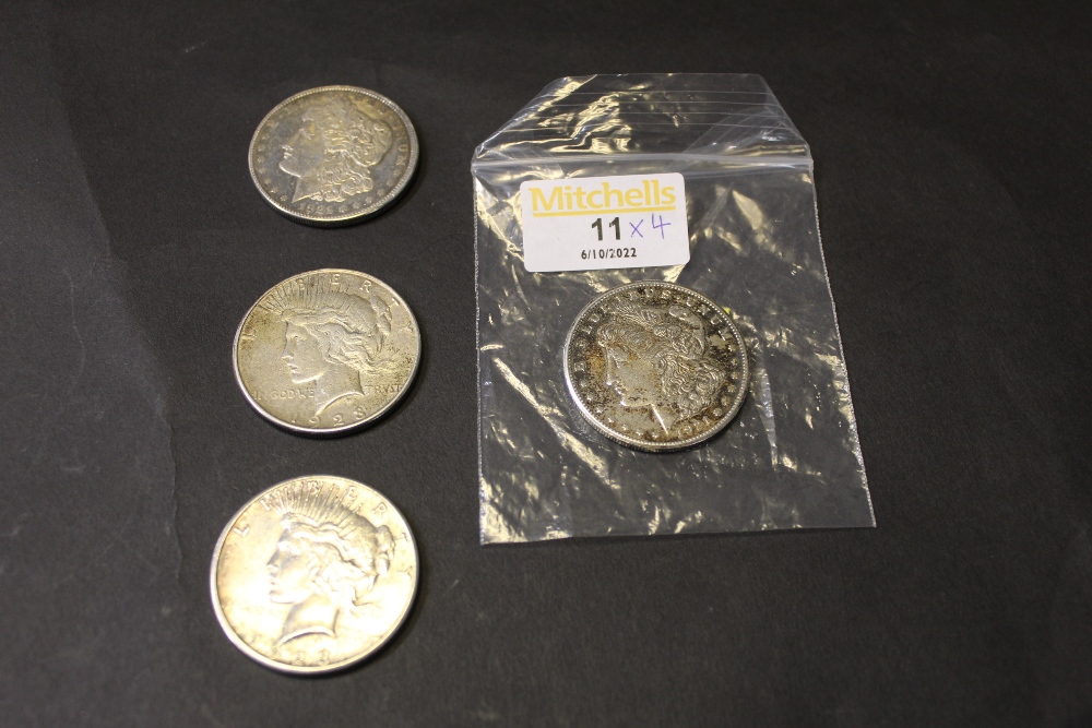 Four silver dollars,