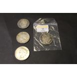 Four silver dollars,
