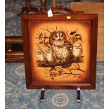 A mahogany firescreen with owl panel