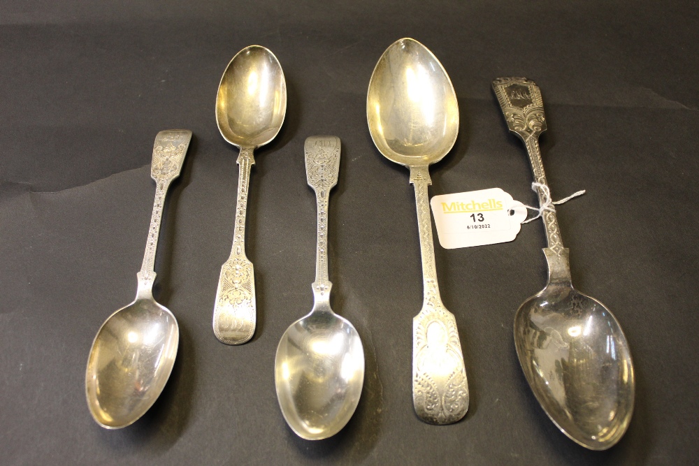 Two silver serving spoons and three silver dessert spoons