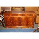 Modern mahogany veneered sideboard with lion mask handles, 82 cm tall,