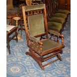 Late 19th century mahogany rocking chair with green cloth back and seat