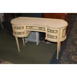 Continental gilt and cream dressing table, raised on reeded legs, 82 cm tall,