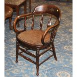 20th century oak spindle backed elbow chair with leather seat