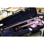 Cased purple violin