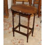 Oak oval shaped occasional table with barley twist supports, 76 cm tall, 63 cm wide,