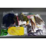 A large quantity of fly tying materials, to include Lakeland Fly Tying, Veniard, Whiting, hackles,