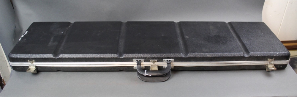 A plastic rifle case with foam lined interior. Length 124 cm.