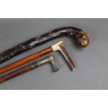 Two malacca riding crops, one with priest handle the other with stag antler handle,