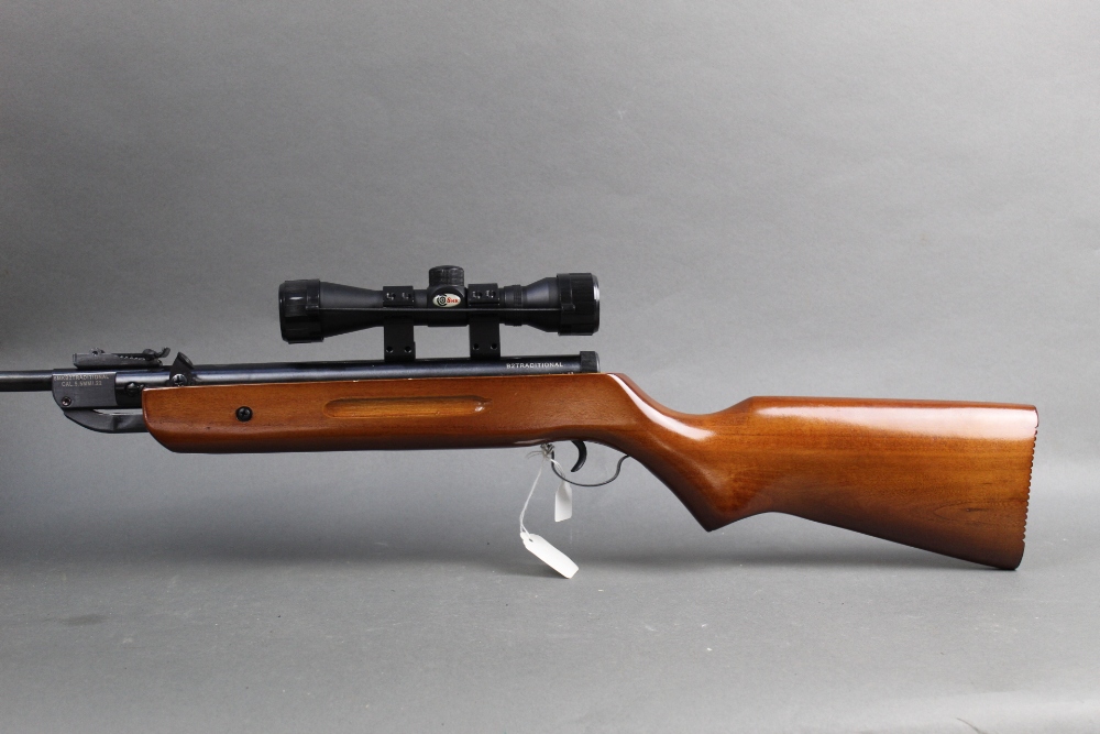 A SMK B2 traditional cal 22 break barrel air rifle, fitted with an SMK 4 x 32 telescopic sight.