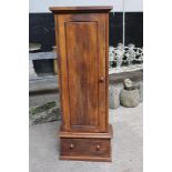 An oak gun cabinet with space for five guns, with single drawer below, comes with keys.