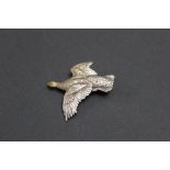 A silver Grouse brooch, showing signs of silver gilt to the head and wing,