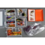 Five boxes and a bag of salmon flies.