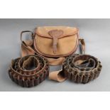 A Quality Gun Slips canvas and leather cartridge bag, together with two 12 bore cartridge belts.