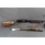 A Mossberg 12 bore pump action shotgun,