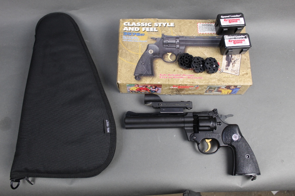 A Crosman 357 cal 177 air gun, with 6 magazines original box and a pistol pouch,