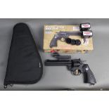 A Crosman 357 cal 177 air gun, with 6 magazines original box and a pistol pouch,