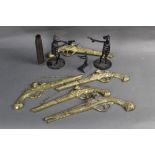 Five brass wall hanging flintlock pistol decorations,