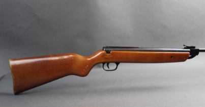 A Milbro G27 cal 22 break barrel air rifle, fitted with a beech stock, no visible serial number.