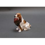 A Royal Doulton figure of a spaniel with pheasant, stamped HN1029. Height 9 cm.